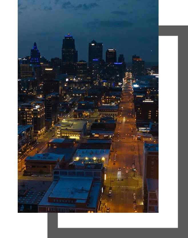 A city at night with lights and buildings