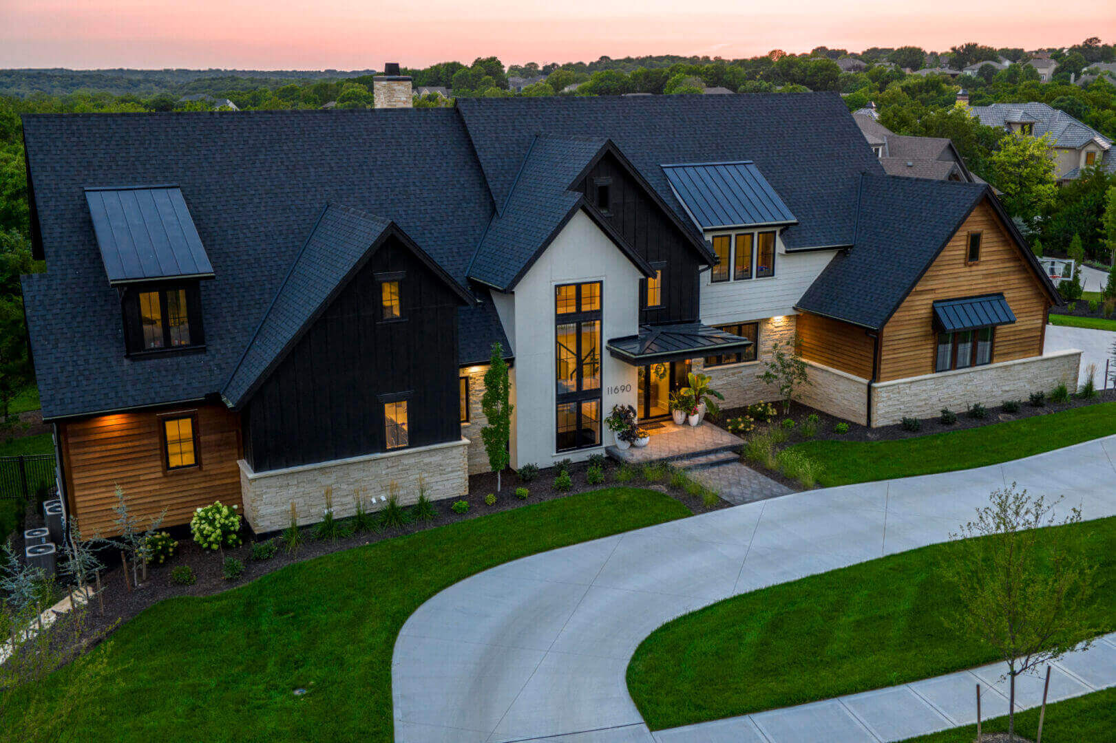 A large house with a driveway in front of it